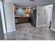 Spacious kitchen featuring stainless steel appliances, granite countertops, and wood cabinetry at 7114 Parrot Dr, Port Richey, FL 34668