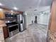 Well-lit kitchen boasts stainless steel appliances and lots of open space at 7114 Parrot Dr, Port Richey, FL 34668