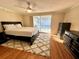 Bedroom features a sliding glass door offering direct access to the pool at 7114 Parrot Dr, Port Richey, FL 34668