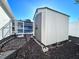 Image of the storage shed located in the backyard of the property at 7114 Parrot Dr, Port Richey, FL 34668