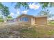 This house has a large backyard with an enclosed lanai at 7336 Cherry Laurel Dr, Port Richey, FL 34668