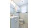 Modern bathroom features updated vanity, toilet, and decorative tiled wall at 7336 Cherry Laurel Dr, Port Richey, FL 34668