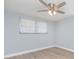 Bright bedroom with light-colored walls, wood floors, and a ceiling fan at 7336 Cherry Laurel Dr, Port Richey, FL 34668
