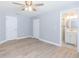 Bedroom featuring wood floors, ensuite bathroom, and closet for ample storage at 7336 Cherry Laurel Dr, Port Richey, FL 34668