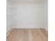 Walk-in closet offers open storage with multiple levels of metal shelving at 7336 Cherry Laurel Dr, Port Richey, FL 34668