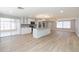 Open kitchen with a large island, granite countertops, and stainless steel appliances at 7336 Cherry Laurel Dr, Port Richey, FL 34668