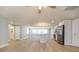 Open floor plan with wood floors, neutral walls, and a modern kitchen at 7336 Cherry Laurel Dr, Port Richey, FL 34668