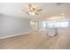 A spacious living room, light-colored wood floors, and an open kitchen island blend seamlessly at 7336 Cherry Laurel Dr, Port Richey, FL 34668