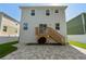 Backyard features a wooden deck, brick patio and a white fence surrounding the perimeter at 7513 S Sherrill St, Tampa, FL 33616