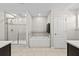 Bathroom featuring a separate shower and tub with decorative tile accents at 7513 S Sherrill St, Tampa, FL 33616