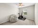Bedroom with a ceiling fan, a bean bag chair, exercise equipment and a window for natural light at 7513 S Sherrill St, Tampa, FL 33616