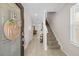 Bright Foyer with a clear view into the Living Room, with decorative Tile Flooring at 7513 S Sherrill St, Tampa, FL 33616