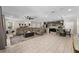 Expansive living area showcases an open floor plan, neutral tones, and modern fixtures adjacent to the kitchen at 7513 S Sherrill St, Tampa, FL 33616