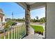 Inviting Porch featuring stone-accented columns and manicured front yard at 7513 S Sherrill St, Tampa, FL 33616