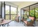 Cozy balcony with comfortable seating, side tables and views at 8198 Terrace Garden N Dr # 411, St Petersburg, FL 33709
