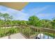 The balcony has views of beautiful mature landscaping at 8198 Terrace Garden N Dr # 411, St Petersburg, FL 33709