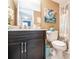 This bathroom features a dark vanity and a bathtub with a shower at 8198 Terrace Garden N Dr # 411, St Petersburg, FL 33709