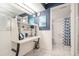 This bathroom features a vanity area with storage and a tub and shower at 8198 Terrace Garden N Dr # 411, St Petersburg, FL 33709