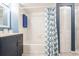 This is a well lit bathroom with a tub and a shower at 8198 Terrace Garden N Dr # 411, St Petersburg, FL 33709