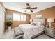 The bedroom has a ceiling fan and a view out of the window at 8198 Terrace Garden N Dr # 411, St Petersburg, FL 33709