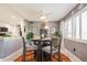Eat-in kitchen and dining space has a ceiling fan and large windows for natural light at 8198 Terrace Garden N Dr # 411, St Petersburg, FL 33709