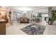 Formal dining room with grey walls and marble flooring opens up into the kitchen at 8198 Terrace Garden N Dr # 411, St Petersburg, FL 33709