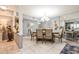 Elegant dining room with marble floors, chandelier lighting, and seating for six at 8198 Terrace Garden N Dr # 411, St Petersburg, FL 33709