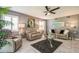 Bright living room with comfortable sofas, modern decor, and large windows at 8198 Terrace Garden N Dr # 411, St Petersburg, FL 33709