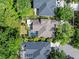 This aerial shot captures the beauty of the caged pool, mature landscaping, and well-maintained neighboring homes at 8376 Golden Prairie Dr, Tampa, FL 33647
