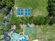 Aerial view of community amenities: playground, basketball, and pickleball courts at 8376 Golden Prairie Dr, Tampa, FL 33647