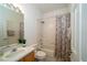 Functional bathroom with vanity, large mirror, and a shower-tub combination at 8376 Golden Prairie Dr, Tampa, FL 33647