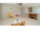 Expansive bonus room, featuring neutral carpet, entertainment center and play area at 8376 Golden Prairie Dr, Tampa, FL 33647