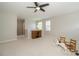 Spacious bonus room with ample lighting, neutral carpet, and entertainment features at 8376 Golden Prairie Dr, Tampa, FL 33647