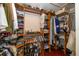 Walk-in closet with custom wood shelving and ample storage space for clothes, shoes, and accessories at 8376 Golden Prairie Dr, Tampa, FL 33647