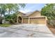 Charming home with a two-car garage and a well-maintained lawn at 8376 Golden Prairie Dr, Tampa, FL 33647
