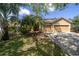 Inviting home showcasing a two-car garage and a well-manicured lawn at 8376 Golden Prairie Dr, Tampa, FL 33647