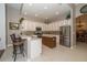 Traditional kitchen with stainless steel appliances, island and breakfast bar at 8376 Golden Prairie Dr, Tampa, FL 33647