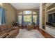 Bright and airy living room, filled with natural light from large windows at 8376 Golden Prairie Dr, Tampa, FL 33647