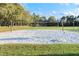 A well maintained outdoor sand volleyball court with a net is ready for a fun match at 8376 Golden Prairie Dr, Tampa, FL 33647