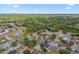 An aerial view of a neighborhood featuring many trees, lakes, and recreational facilities at 930 Balsamina Dr, Brandon, FL 33510