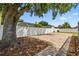 Backyard with a brick patio, mature trees, and a privacy fence at 930 Balsamina Dr, Brandon, FL 33510