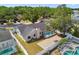 A backyard view of a screened-in pool area with brick patio and fenced yard at 930 Balsamina Dr, Brandon, FL 33510