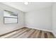 Bedroom with luxury vinyl plank flooring and window view at 930 Balsamina Dr, Brandon, FL 33510