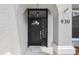 The home's front door features decorative glass, black hardware, and decorative molding at 930 Balsamina Dr, Brandon, FL 33510