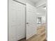 Hallway featuring white closet doors and view of patio/pool at 930 Balsamina Dr, Brandon, FL 33510