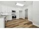 Clean kitchen with white cabinets, stainless appliances, and bright lighting at 930 Balsamina Dr, Brandon, FL 33510