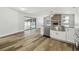 Open kitchen and living room with views of the pool area through sliding glass doors at 930 Balsamina Dr, Brandon, FL 33510