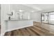 Kitchen with granite countertops, white cabinets, and views to the living room at 930 Balsamina Dr, Brandon, FL 33510
