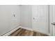 Laundry room with white door and neutral color palette at 930 Balsamina Dr, Brandon, FL 33510