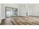 Living room featuring new flooring, light walls, and sliding glass doors to the pool at 930 Balsamina Dr, Brandon, FL 33510
